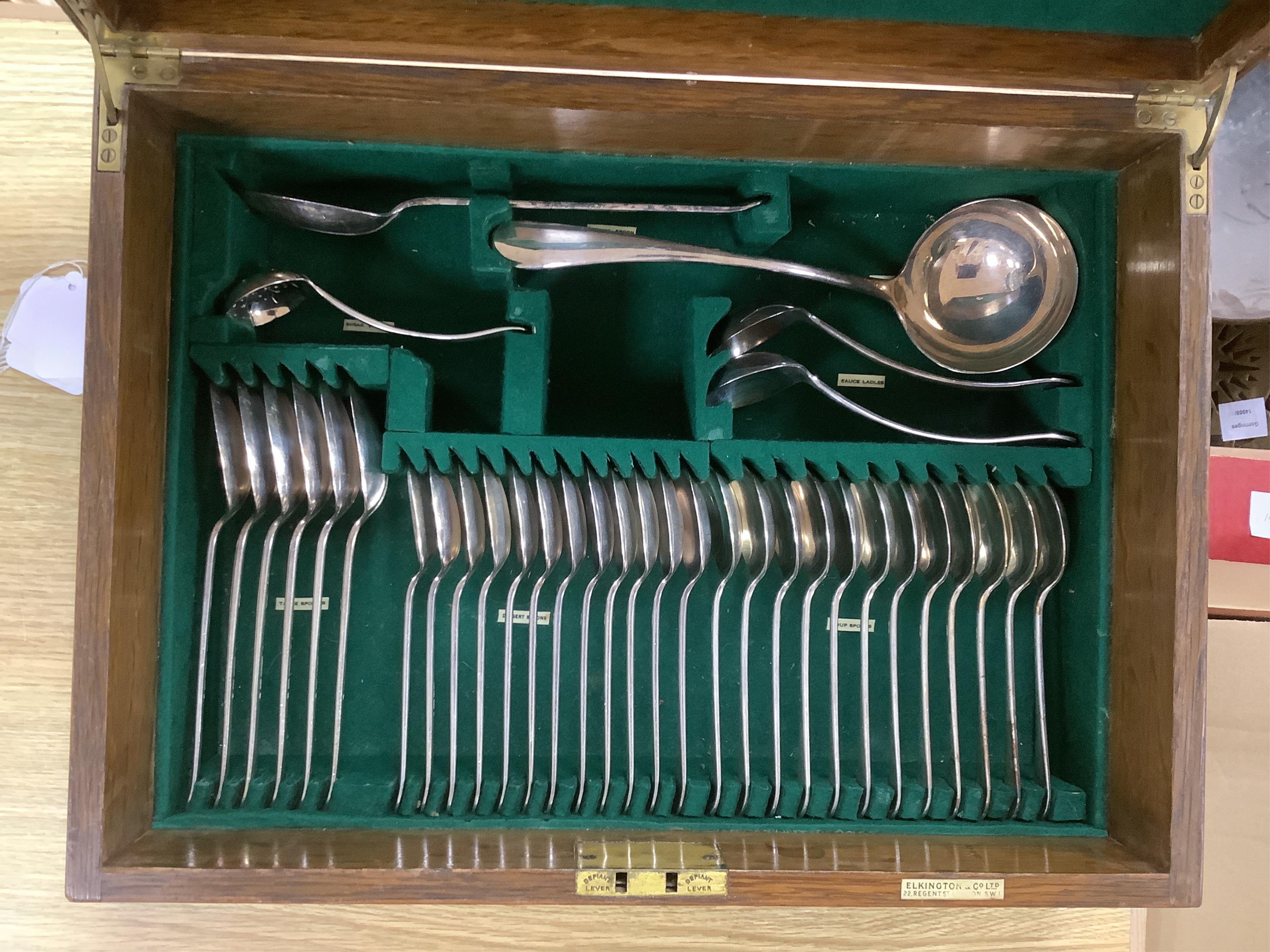 An Elkington & Co plated Old English pattern canteen of cutlery, oak cased, 48cm wide. Condition - fair